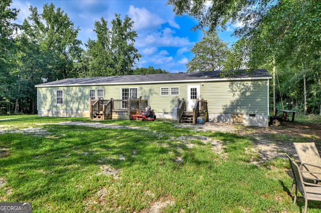 a view of a park with large trees
