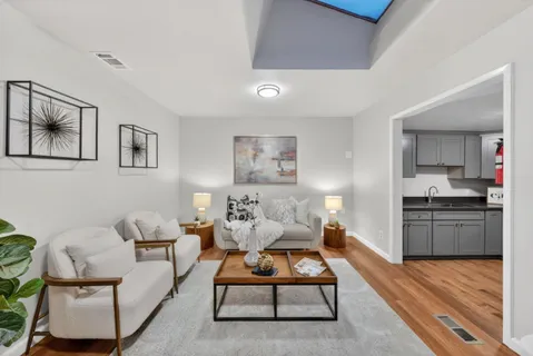 a kitchen with stainless steel appliances granite countertop a stove sink microwave and refrigerator