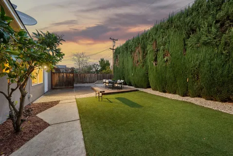 a view of a patio with a yard