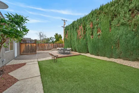 a view of a backyard with a patio