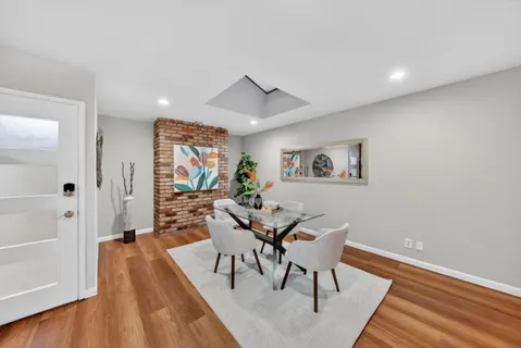 a view of a livingroom with furniture and wooden floor