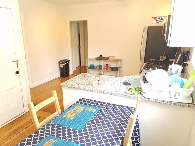 a view of a kitchen with workspace and a window