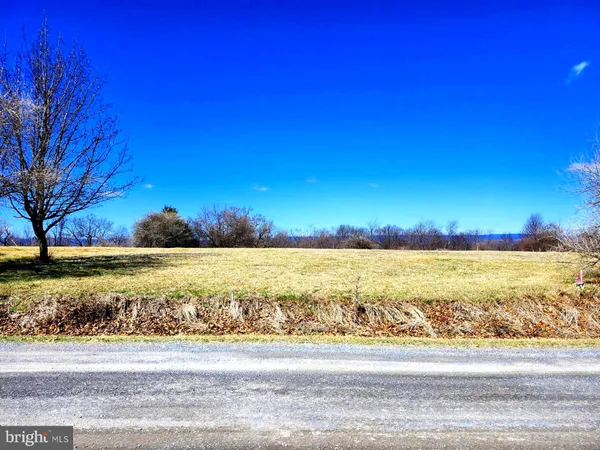 a view of a yard with an ocean