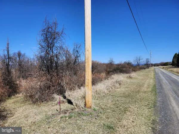 a view of a yard covered with snow in the background