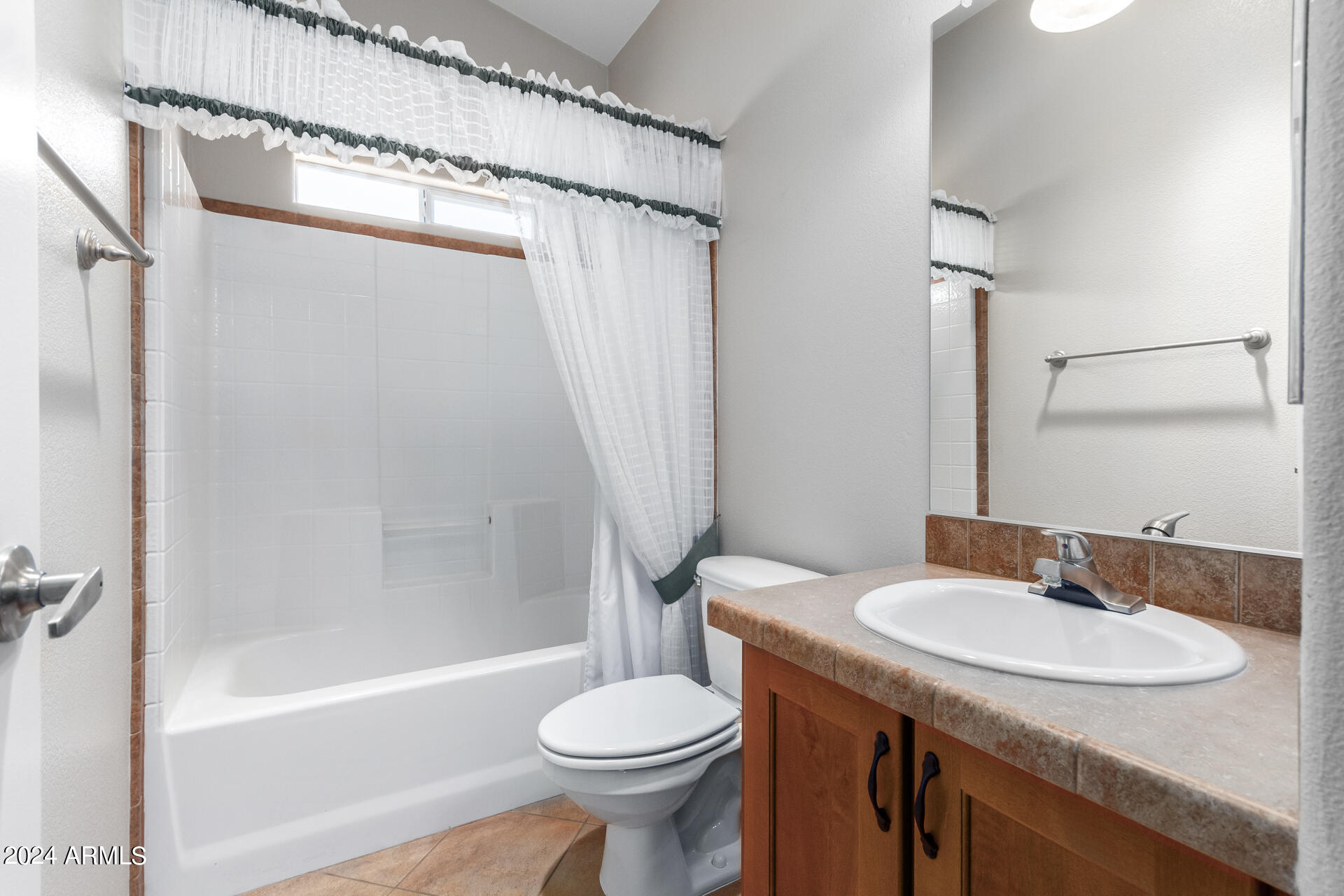2550 South Ellsworth Road, Unit 366 Mesa, AZ 85209 - Photo 19 of 27 a bathroom with a sink toilet and shower