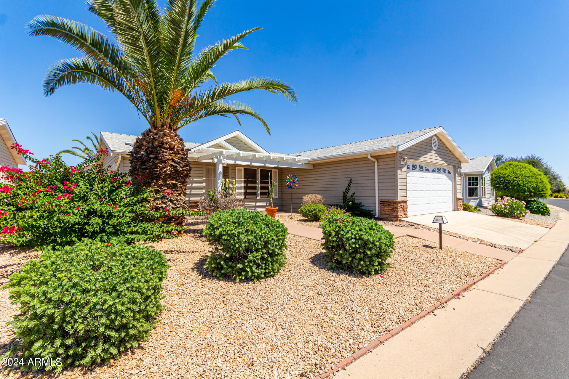 2550 South Ellsworth Road, Unit 366 Mesa, AZ 85209 - Photo 2 of 27 a front view of a house with a yard