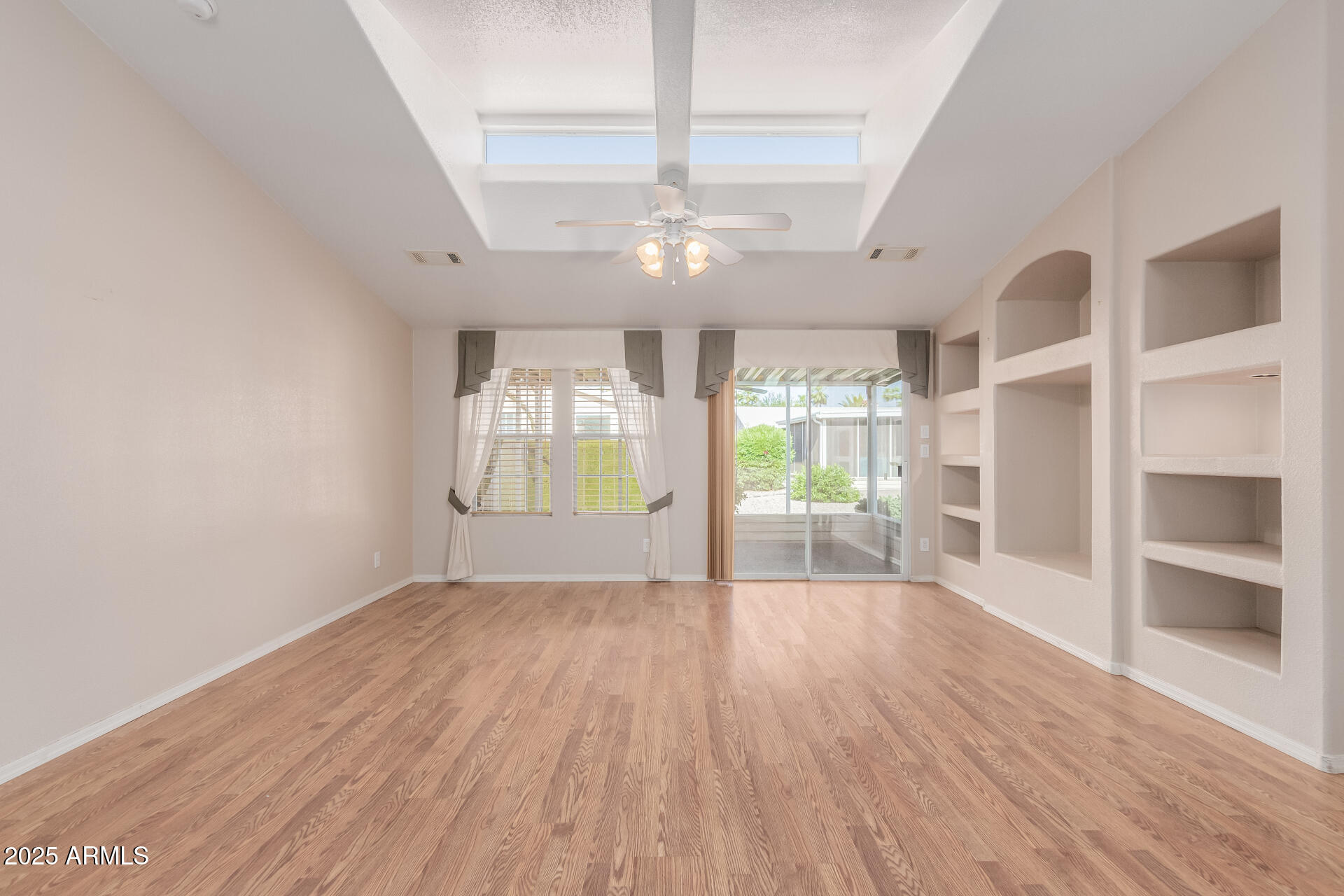 2550 South Ellsworth Road, Unit 366 Mesa, AZ 85209 - Photo 6 of 27 a view of an empty room with a window