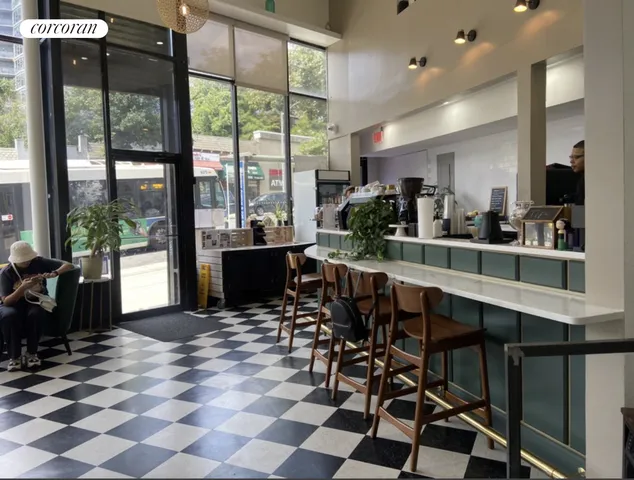 a kitchen with a refrigerator and a sink