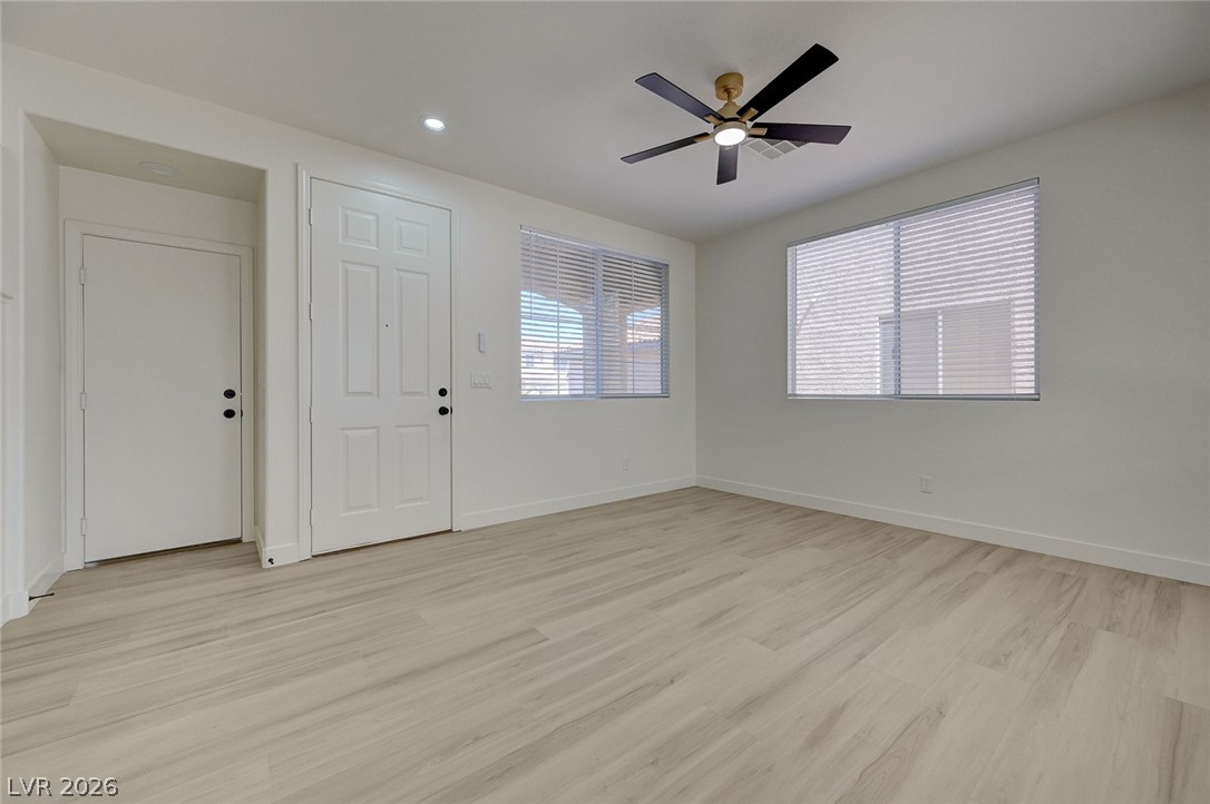 9687 Ridgebluff Avenue Las Vegas, NV 89148 - Photo 20 of 57 Foyer with light wood-style flooring, ceiling fan, and recessed lighting