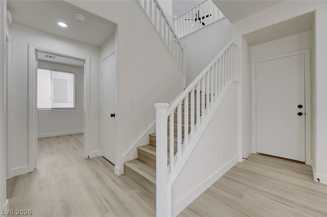 9687 Ridgebluff Avenue Las Vegas, NV 89148 - Photo 22 of 57 Stairway with wood finished floors and recessed lighting