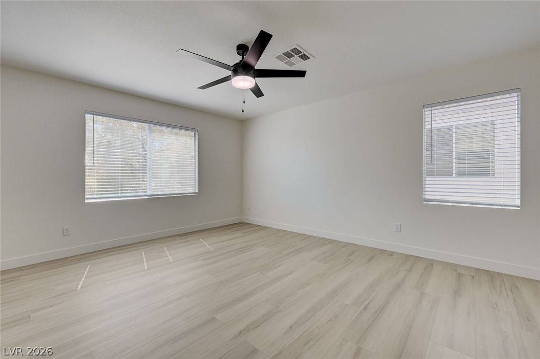 9687 Ridgebluff Avenue Las Vegas, NV 89148 - Photo 32 of 57 Unfurnished room featuring light wood-style floors and a ceiling fan