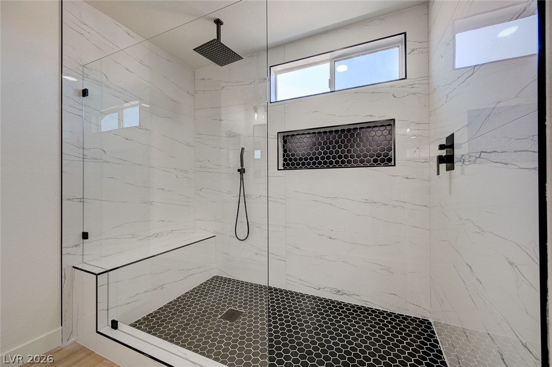 9687 Ridgebluff Avenue Las Vegas, NV 89148 - Photo 37 of 57 Full bathroom featuring a marble finish shower