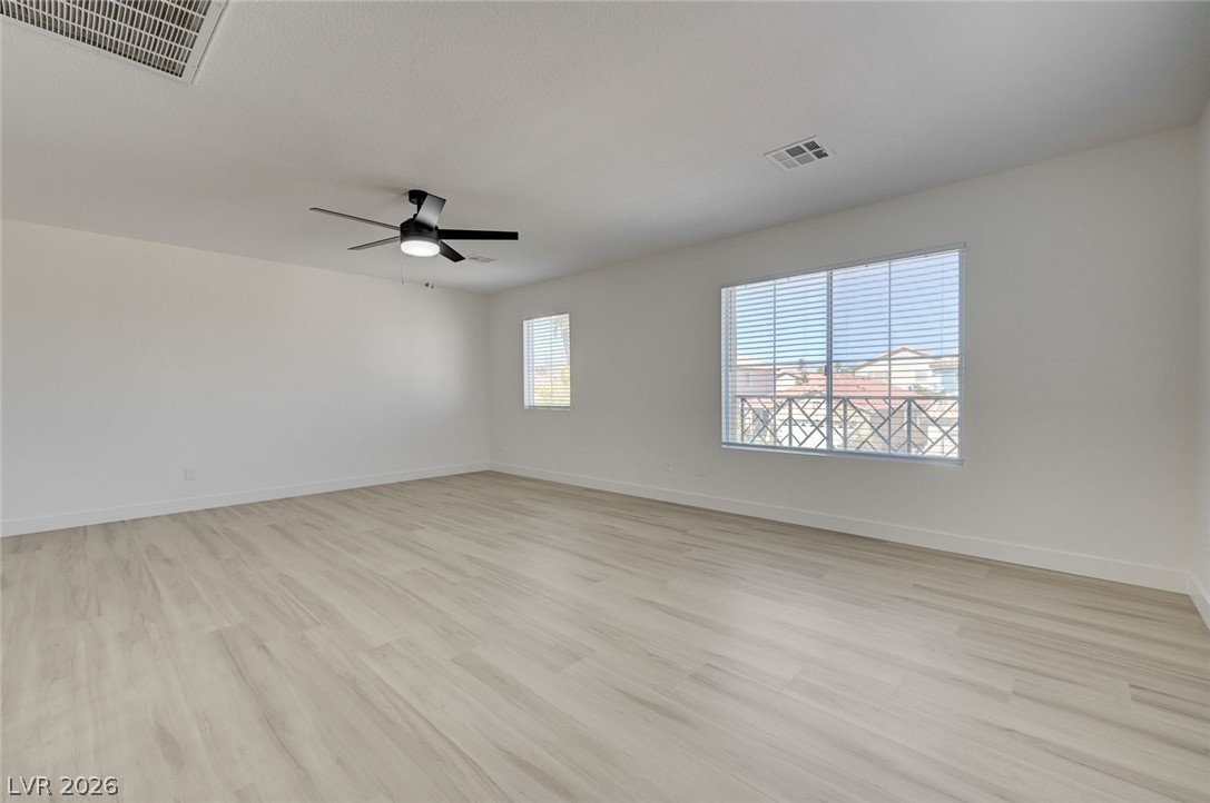 9687 Ridgebluff Avenue Las Vegas, NV 89148 - Photo 40 of 57 Unfurnished room featuring light wood finished floors and ceiling fan