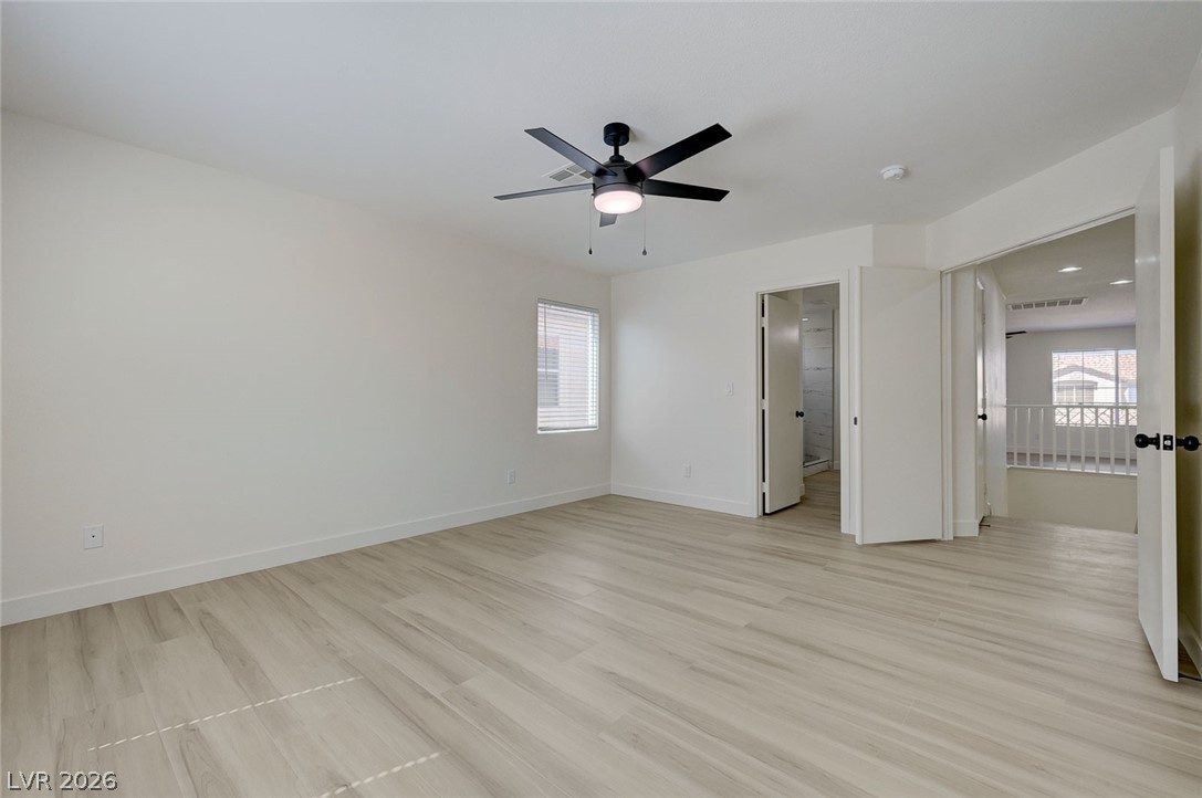 9687 Ridgebluff Avenue Las Vegas, NV 89148 - Photo 44 of 57 Unfurnished bedroom with a ceiling fan and light wood-style flooring