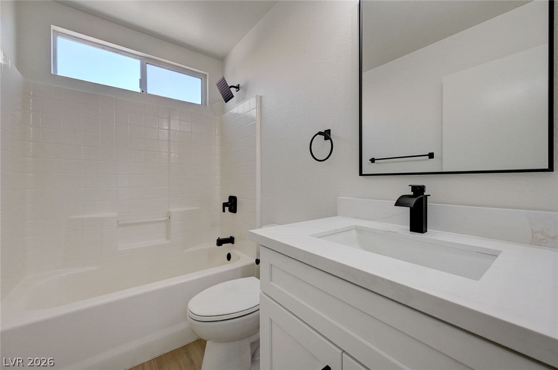 9687 Ridgebluff Avenue Las Vegas, NV 89148 - Photo 48 of 57 Bathroom featuring vanity, bathing tub / shower combination, and light wood finished floors