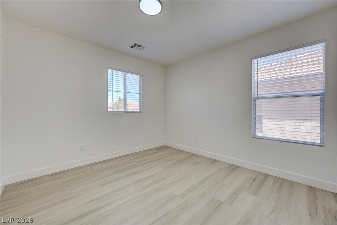 9687 Ridgebluff Avenue Las Vegas, NV 89148 - Photo 49 of 57 Unfurnished room with baseboards and light wood-style flooring