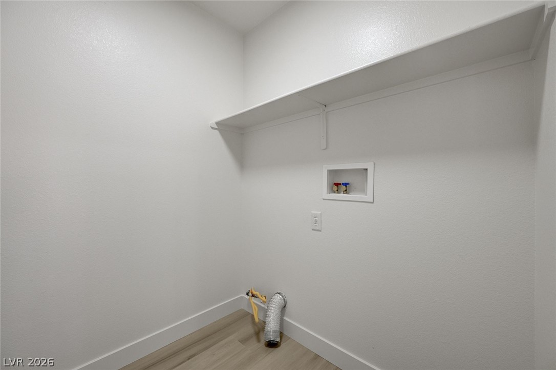 9687 Ridgebluff Avenue Las Vegas, NV 89148 - Photo 52 of 57 Laundry area featuring light wood-type flooring and washer hookup