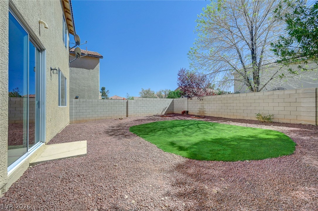 9687 Ridgebluff Avenue Las Vegas, NV 89148 - Photo 53 of 57 Fenced backyard with a patio area