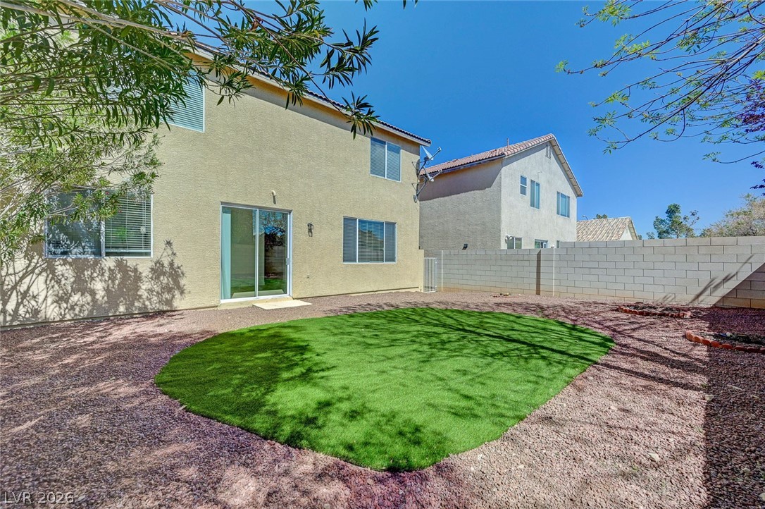 9687 Ridgebluff Avenue Las Vegas, NV 89148 - Photo 54 of 57 Rear view of property featuring stucco siding, a fenced backyard, and a patio area