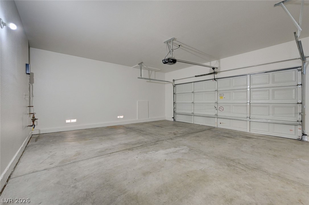 9687 Ridgebluff Avenue Las Vegas, NV 89148 - Photo 56 of 57 Garage with baseboards and a garage door opener
