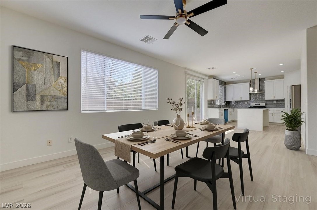 9687 Ridgebluff Avenue Las Vegas, NV 89148 - Photo 7 of 57 Dining space featuring light wood-type flooring, plenty of natural light, a ceiling fan, and recessed lighting