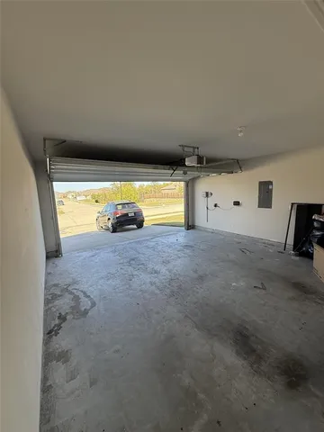 a view of an empty room and a window