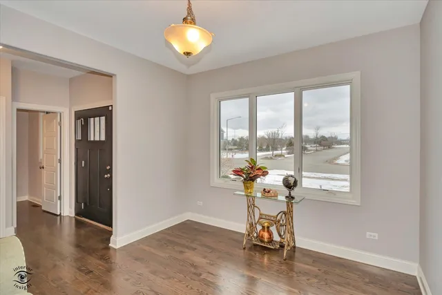 a view of a livingroom with furniture and a window