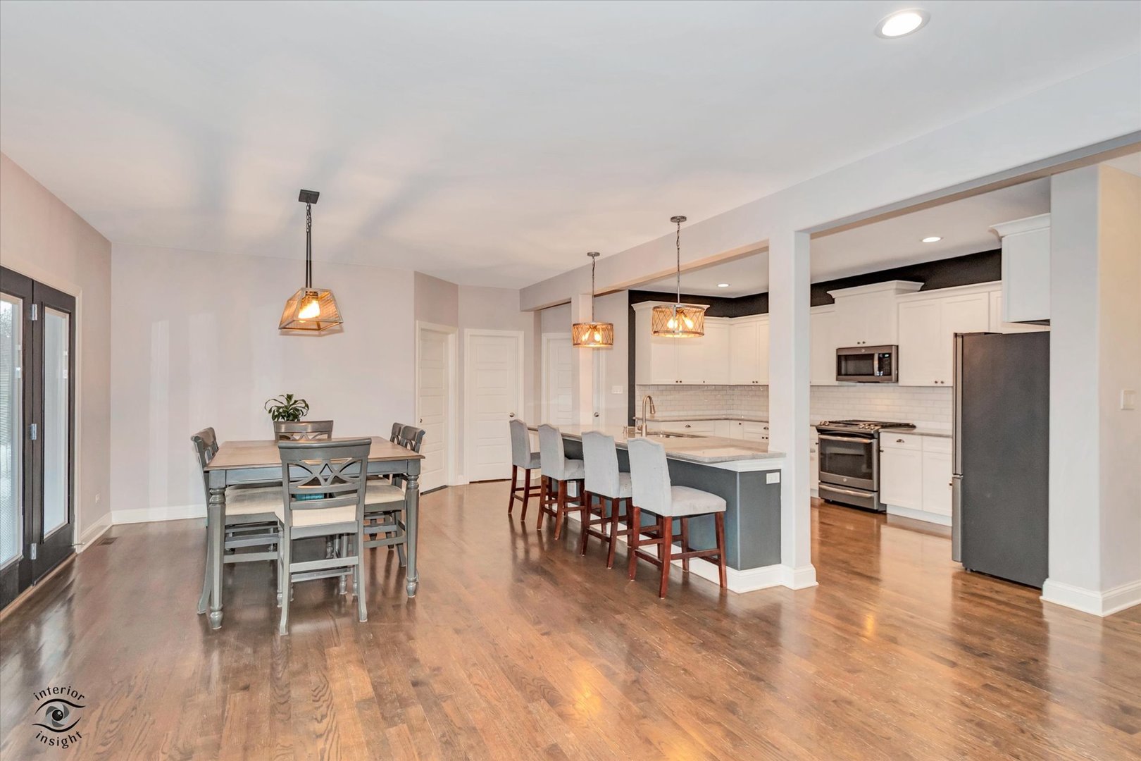 1973 Edgeview Drive New Lenox, IL 60451 - Photo 19 of 39 a dining room with furniture a chandelier and wooden floor