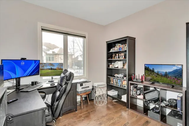 a view of a livingroom with furniture and a flat screen tv
