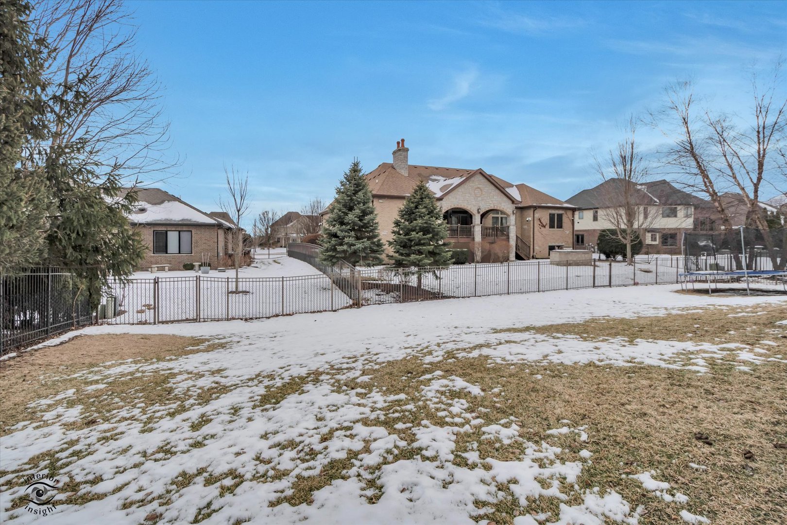 1973 Edgeview Drive New Lenox, IL 60451 - Photo 7 of 39 a front view of a house with a yard covered in snow
