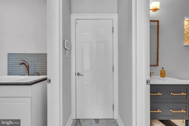 a bathroom with a sink and cabinets