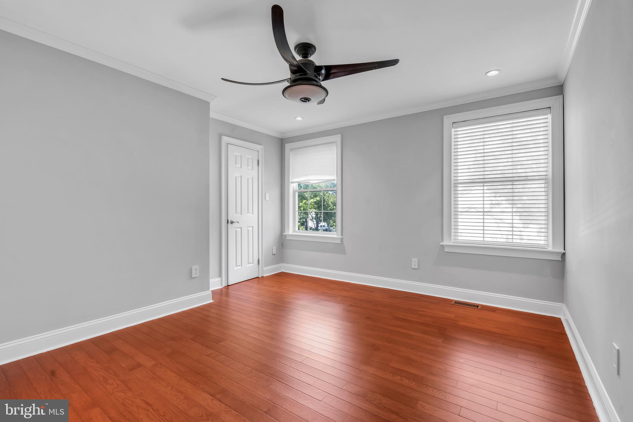 1 Crisfield Road Sicklerville, NJ 08081 - Photo 26 of 45 a view of empty room with wooden floor and fan