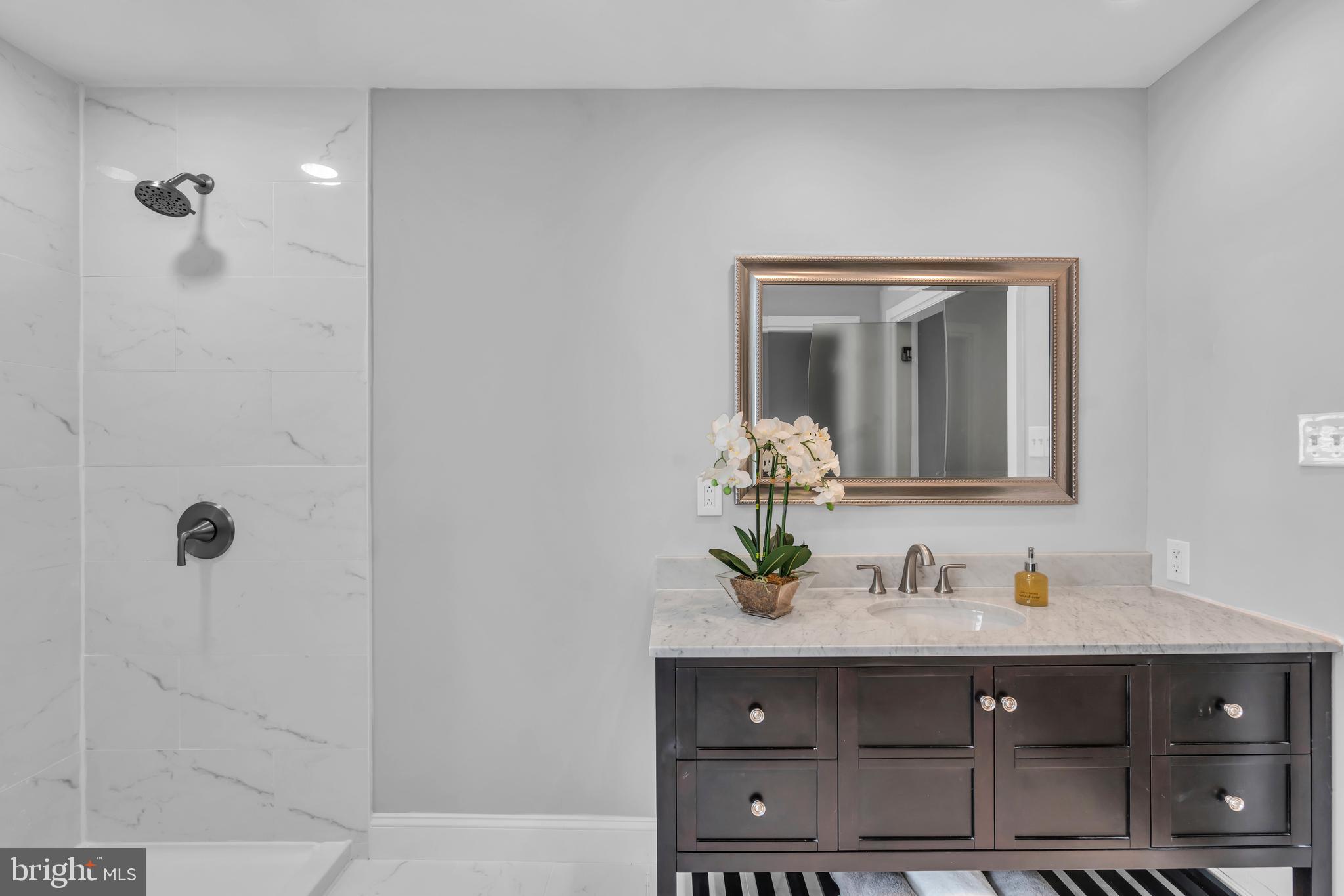 1 Crisfield Road Sicklerville, NJ 08081 - Photo 31 of 45 a bathroom with a sink and a mirror