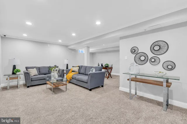 a living room with furniture and a rug