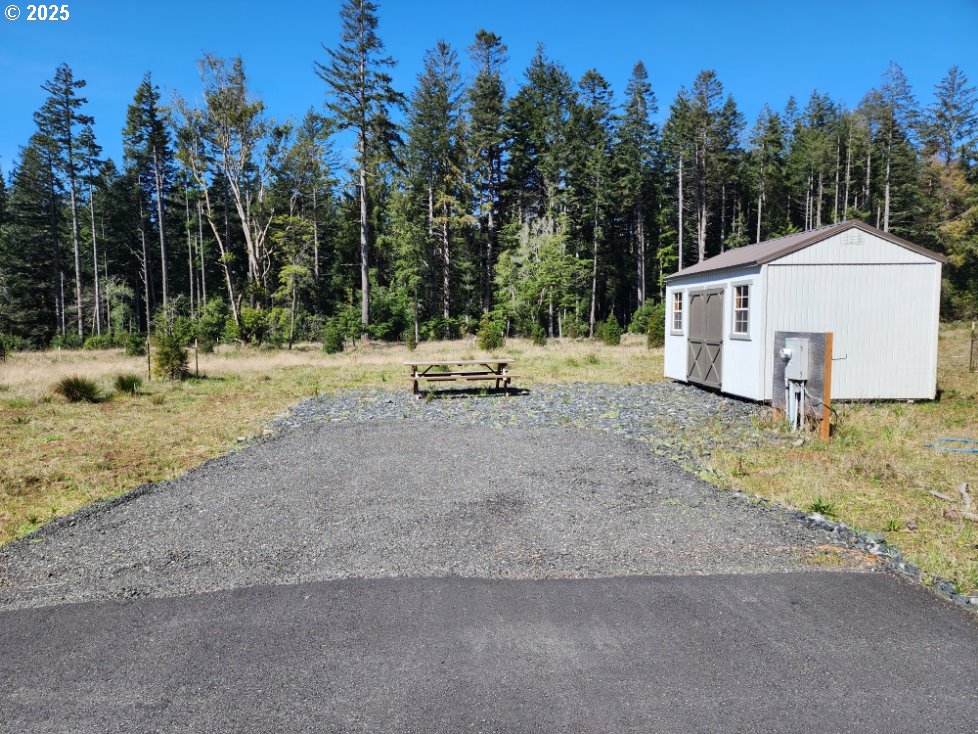 Hubbard Lane, Unit 4 Port Orford, OR 97465 - Photo 1 of 8 a view of a house with a yard covered in snow
