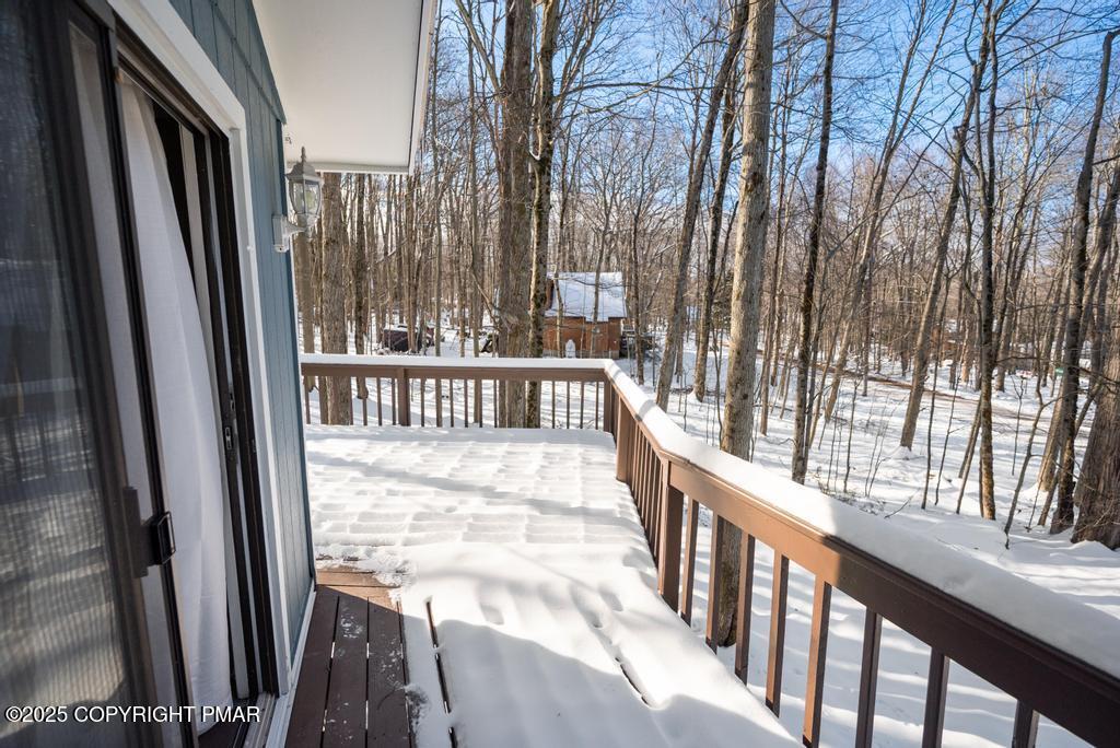 136 Netcong Circle Pocono Lake, PA 18347 - Photo 13 of 40 a view of balcony with wooden floor and fence