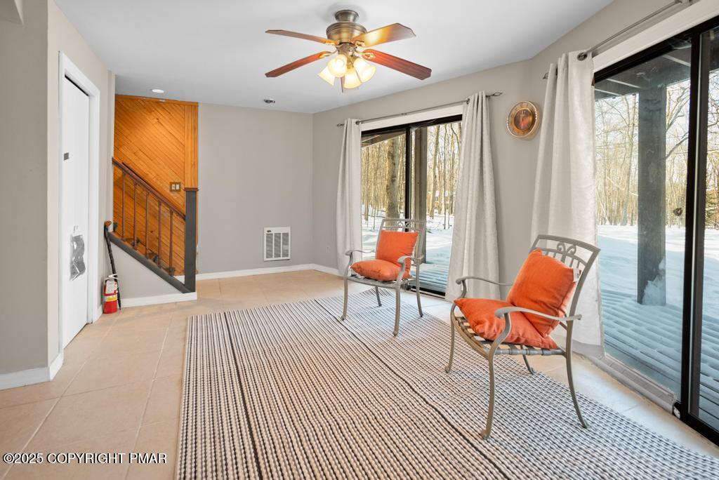 136 Netcong Circle Pocono Lake, PA 18347 - Photo 19 of 40 a bedroom with a bed and wooden floor