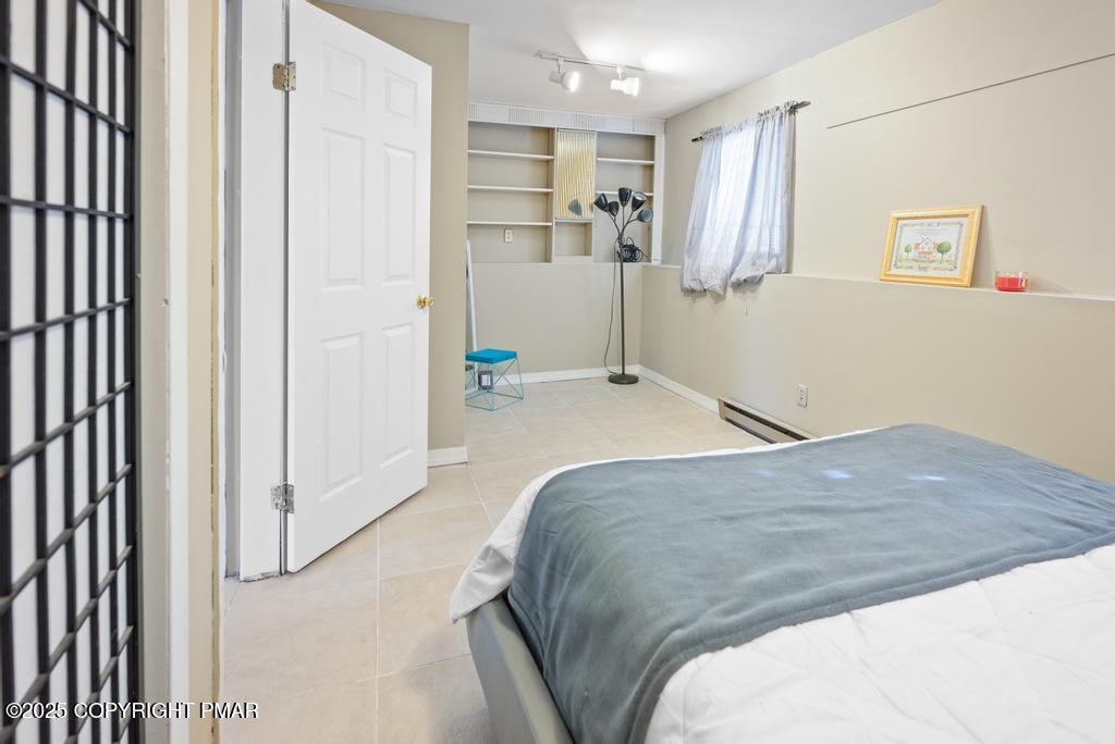 136 Netcong Circle Pocono Lake, PA 18347 - Photo 24 of 40 a bed room with a bed and a window