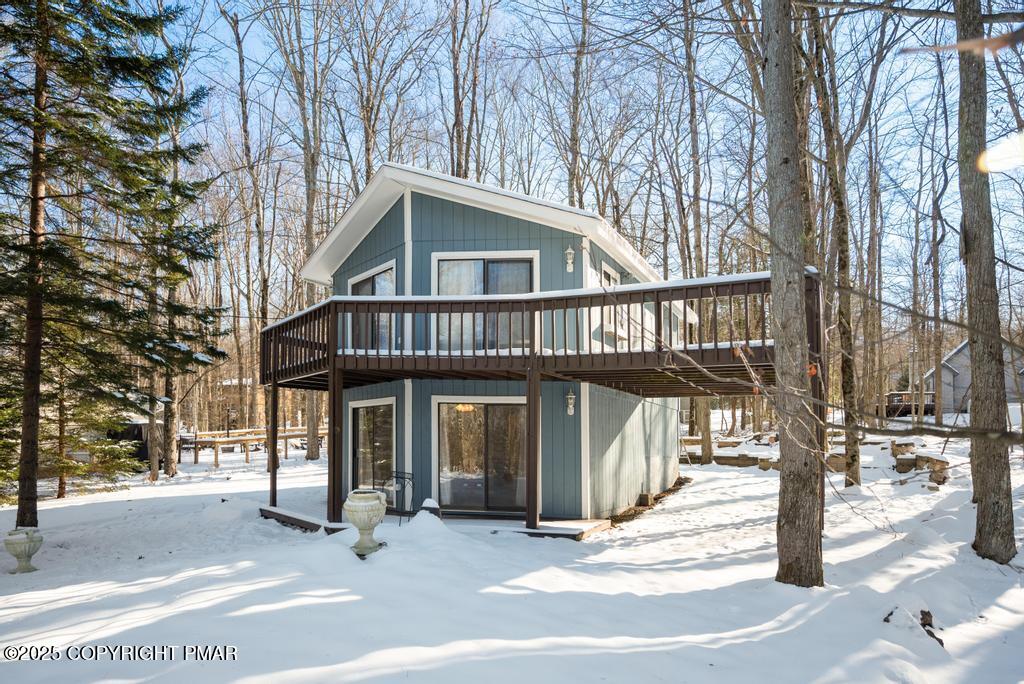 136 Netcong Circle Pocono Lake, PA 18347 - Photo 4 of 40 a front view of a house with garden and trees