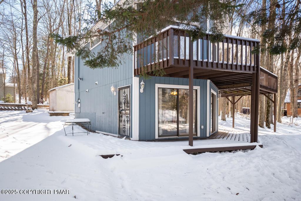 136 Netcong Circle Pocono Lake, PA 18347 - Photo 5 of 40 a view of a house with wooden floor and a large tree
