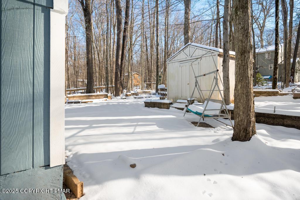 136 Netcong Circle Pocono Lake, PA 18347 - Photo 6 of 40 a view of a house with backyard and sitting area