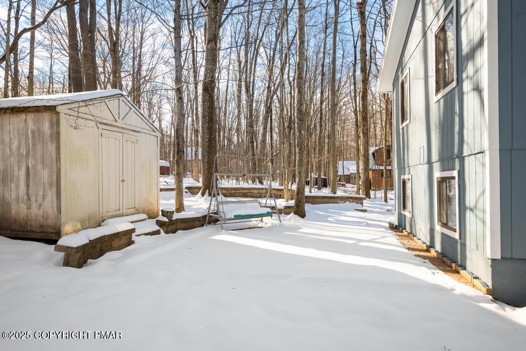 136 Netcong Circle Pocono Lake, PA 18347 - Photo 8 of 40 a view of a street with a large window and tree
