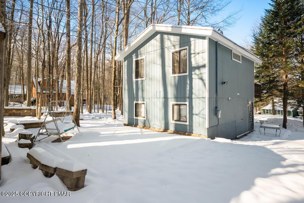 136 Netcong Circle Pocono Lake, PA 18347 - Photo 9 of 40 a building exterior with furniture