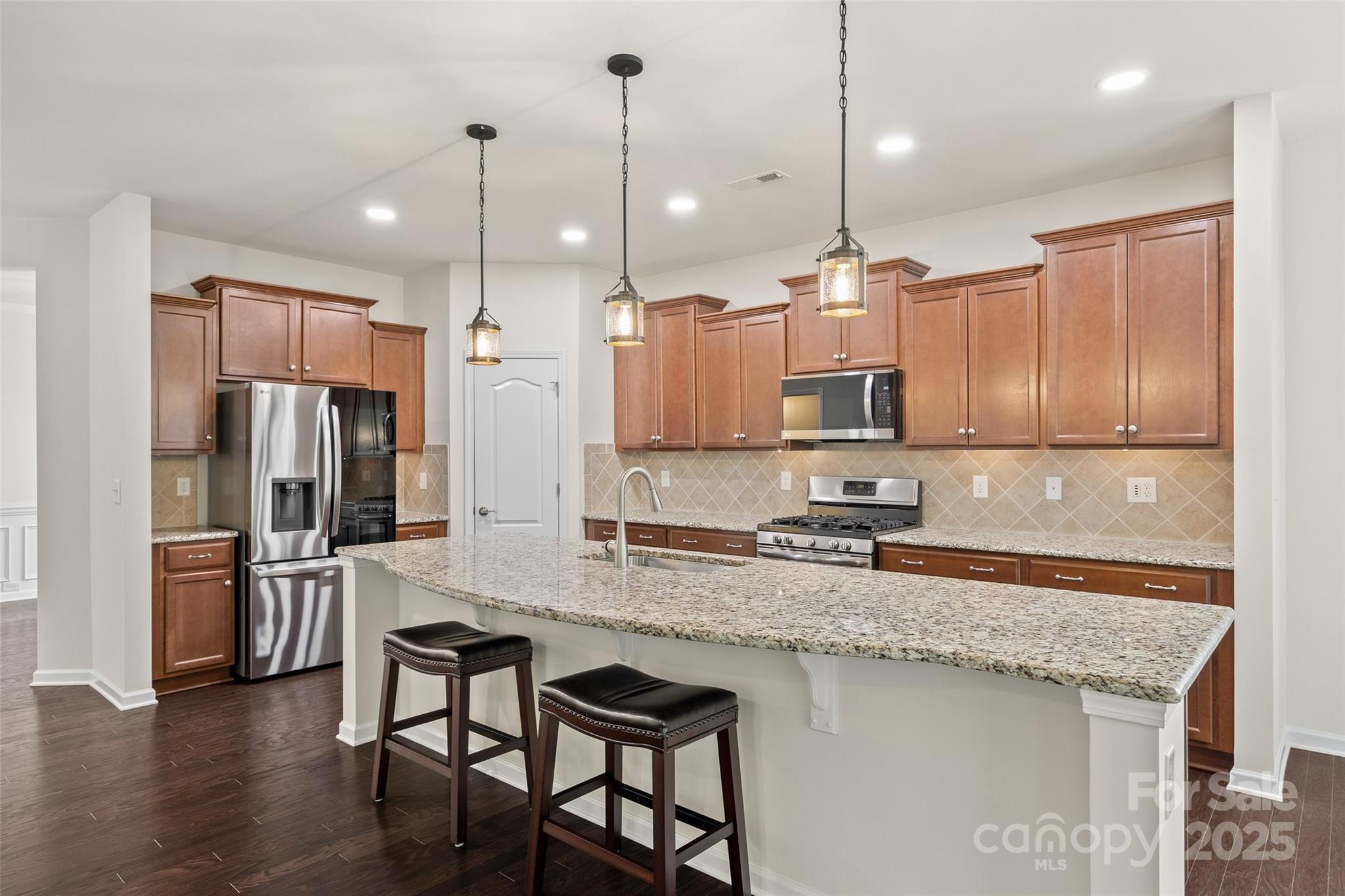 2337 Talon Point Circle Fort Mill, SC 29715 - Photo 11 of 48 a kitchen with stainless steel appliances granite countertop a refrigerator a sink and a stove