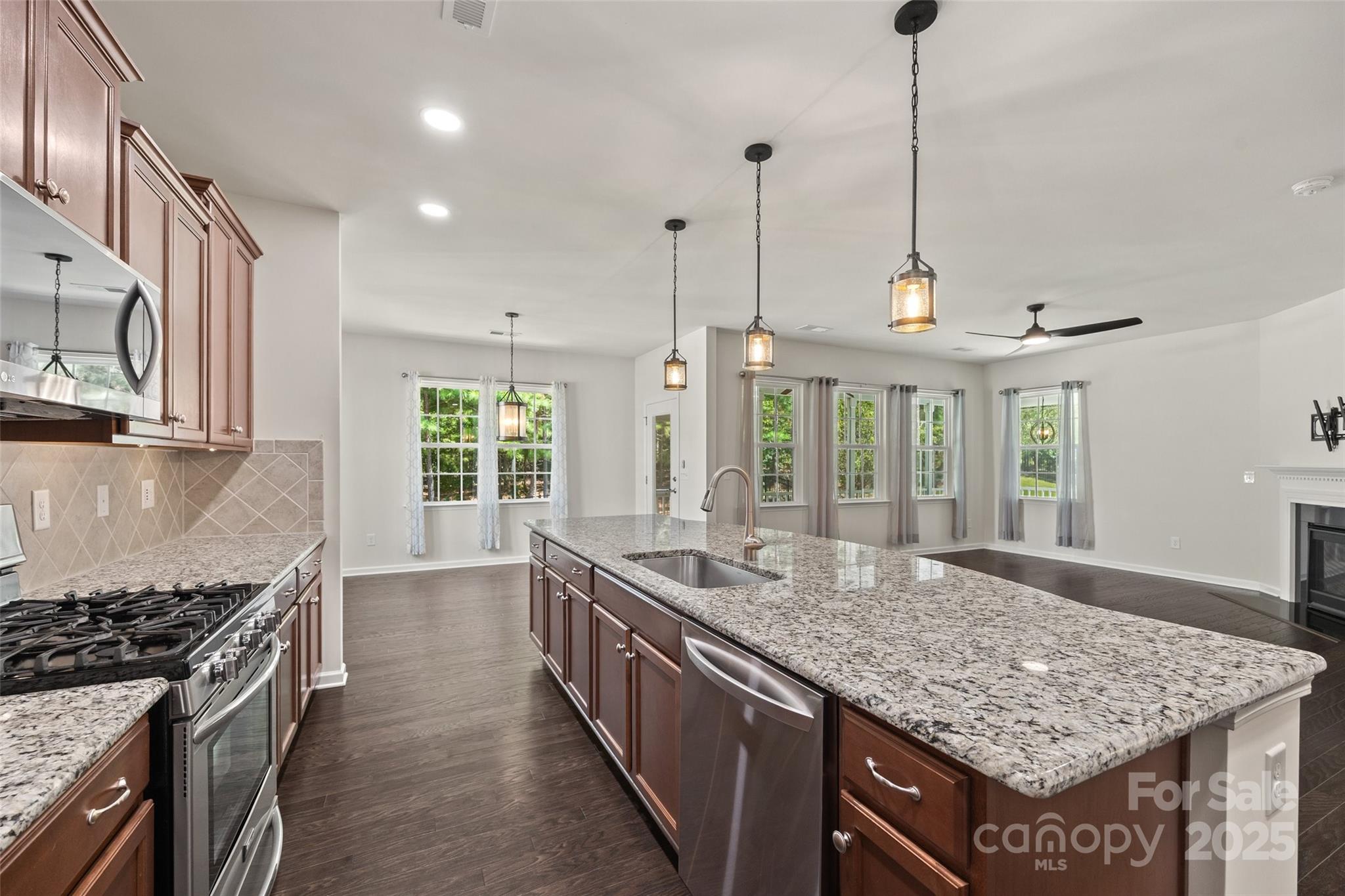 2337 Talon Point Circle Fort Mill, SC 29715 - Photo 14 of 48 a kitchen with kitchen island a counter top space a sink stainless steel appliances and a counter top space