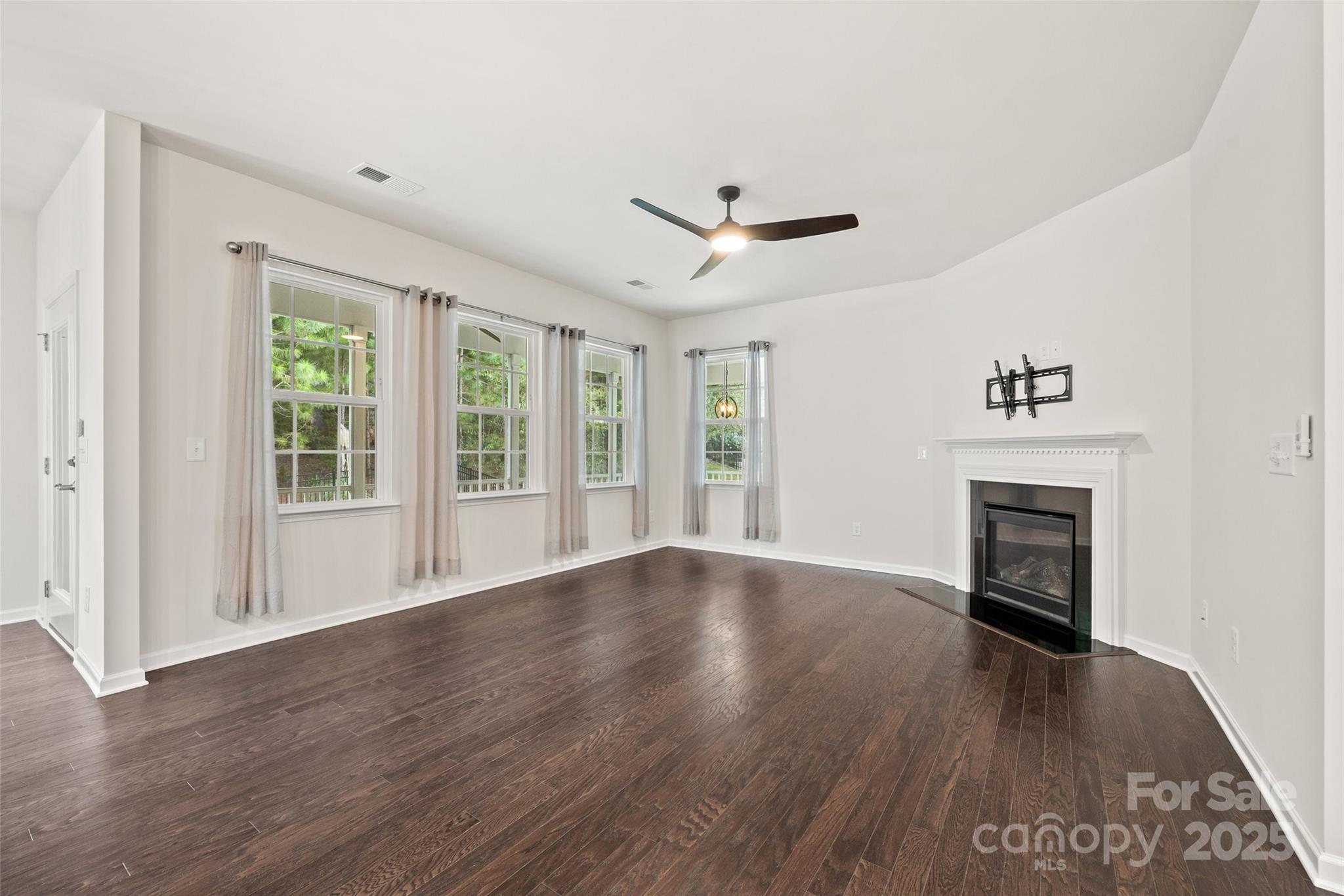 2337 Talon Point Circle Fort Mill, SC 29715 - Photo 19 of 48 a view of an empty room with wooden floor and a window