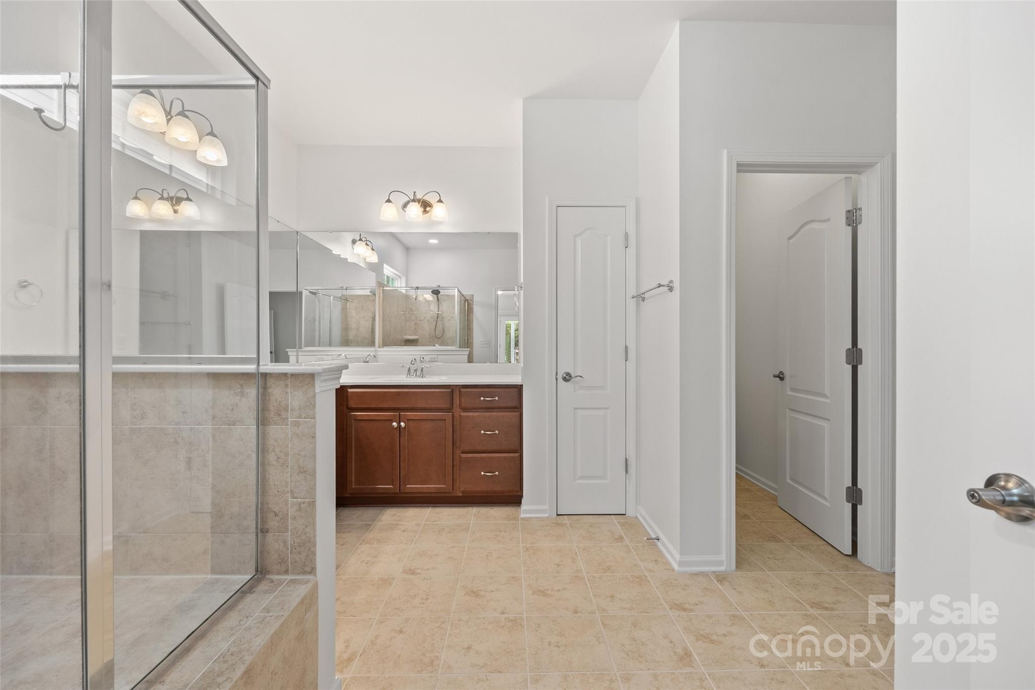 2337 Talon Point Circle Fort Mill, SC 29715 - Photo 24 of 48 a bathroom with a granite countertop sink mirror and shower