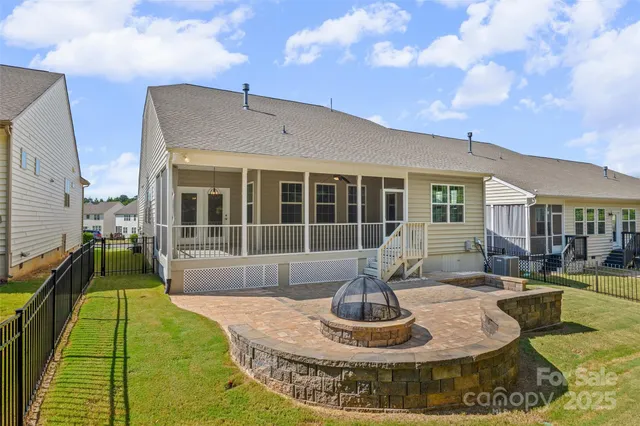 a view of a house with swimming pool and couches chairs