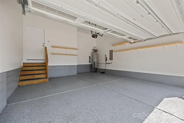 an aerial view of a house with a yard basket ball court and outdoor seating