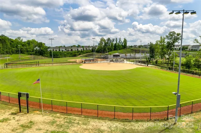 a view of a balcony with floor to ceiling windows with wooden floor